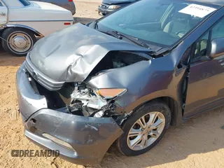 2010 Honda Insight EX with VIN JHMZE2H74AS027020, listed as a IAAI auction lot 42394875 with 248,003 mi miles and . Bid and sale history available at DreamBid. Image 6.