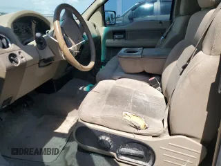 2006 Ford F-150 STX with VIN 1FTRX12W16FB16422, listed as a Copart auction lot 62468955 with 203,721 mi miles and Salvage title. Bid and sale history available at DreamBid. Image 7.