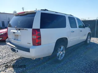 2011 Chevrolet Suburban LT with VIN 1GNSCJE05BR357775, listed as a IAAI auction lot 41807667 with 327,313 mi miles. Bid and sale history available at carsss.com. Image 4.