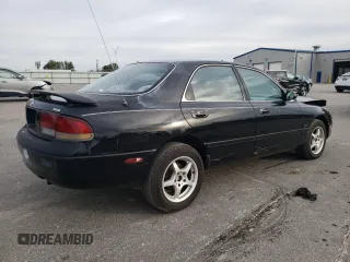 1996 Mazda 626 z VIN 1YVGE22C2T5585359, wystawiony jako Copart lot #74568444 z przebiegiem 159 922 mil mil oraz Szkody całkowita. Historia ofert i sprzedaży dostępna na DreamBid. Obrazek 3.