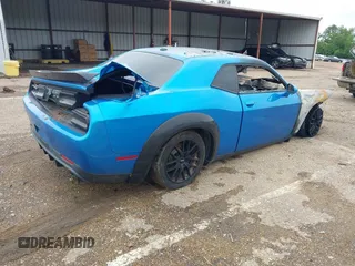 2016 Dodge Challenger R/T Plus with VIN 2C3CDZBT0GH184881, listed as a IAAI auction lot 42214342 with Not provided miles and . Bid and sale history available at DreamBid. Image 4.