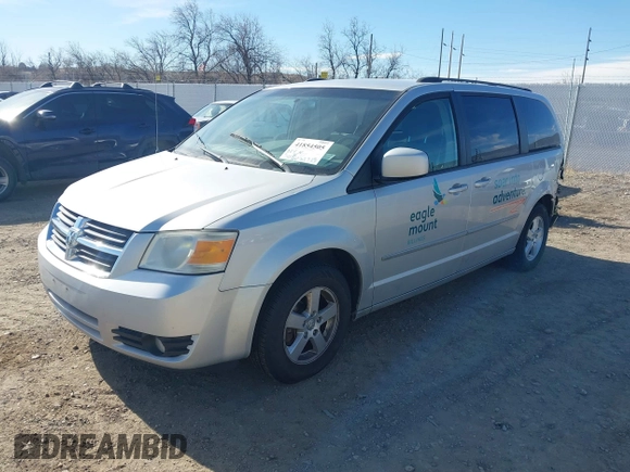 2010 Dodge Grand Caravan SXT with VIN 2D4RN5D19AR406197, listed as a IAAI auction lot 41854505 with 140,760 mi miles and . Bid and sale history available at DreamBid. Image 2.