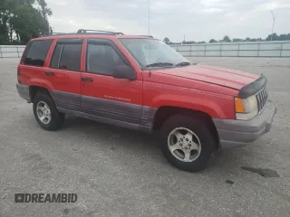 1998 Jeep Grand Cherokee Laredo with VIN 1J4FX58S3WC144684, listed as a Copart auction lot 67226694 with 106,602 mi miles and Clean Title. Bid and sale history available at carsss.com. Image 4.