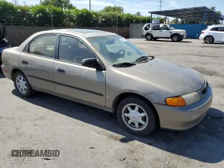 1998 Mazda Protege DX z VIN JM1BC1414W0203670, wystawiony jako Copart lot #62966544 z przebiegiem 249 405 mil mil oraz Szkoda całkowita • Salvage title. Historia ofert i sprzedaży dostępna na DreamBid. Obrazek 4.