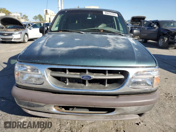 1997 Ford Explorer XL with VIN 1FMDU34E2VZC03015, listed as a Copart auction lot 80654764 with 295,587 mi miles and Salvage title. Bid and sale history available at DreamBid. Image 5.
