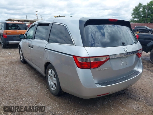 2011 Honda Odyssey LX with VIN 5FNRL5H26BB027144, listed as a IAAI auction lot 42456465 with 201,901 mi miles and . Bid and sale history available at DreamBid. Image 3.