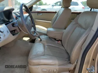 2006 Cadillac DTS 1SC z VIN 1G6KD57Y26U175599, wystawiony jako Copart lot #59149155 z przebiegiem 172 952 mil mil oraz Czysty tytuł • Clean title. Historia ofert i sprzedaży dostępna na DreamBid. Obrazek 7.