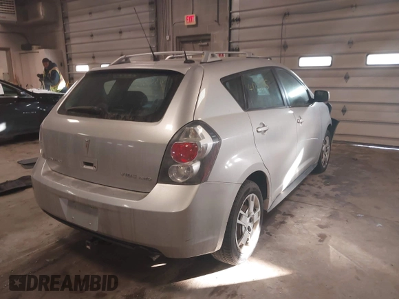 2009 Pontiac Vibe with VIN 5Y2SM67009Z422428, listed as a IAAI auction lot 41356815 with 63,924 mi miles. Bid and sale history available at carsss.com. Image 4.