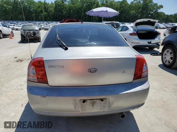 2004 Kia Spectra GS with VIN KNAFB161945141309, listed as a Copart auction lot 52395445 with 99,100 mi miles and Clean Title. Bid and sale history available at DreamBid. Image 6.