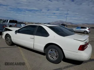 1996 Ford Thunderbird LX z VIN 1FALP62W7TH119284, wystawiony jako Copart lot #71701084 z przebiegiem 239 462 mil mil oraz Szkoda całkowita • Salvage title. Historia ofert i sprzedaży dostępna na DreamBid. Obrazek 2.
