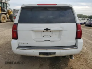 2015 Chevrolet Tahoe LTZ with VIN 1GNSKCKC1FR310018, listed as a Copart auction lot 71798454 with 244,179 mi miles and Salvage title. Bid and sale history available at DreamBid. Image 6.