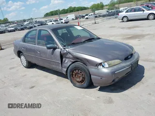 1995 Ford Contour LX z VIN 1FALP6531SK161582, wystawiony jako IAAI lot #42271416 z przebiegiem 125 469 mil mil oraz . Historia ofert i sprzedaży dostępna na DreamBid. Obrazek 1.
