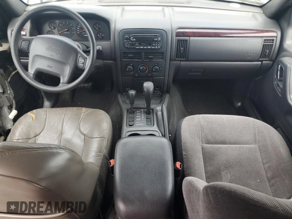 2000 Jeep Grand Cherokee Laredo with VIN 1J4GW48S9YC390448, listed as a Copart auction lot 56985265 with Not provided miles and Salvage title. Bid and sale history available at DreamBid. Image 8.