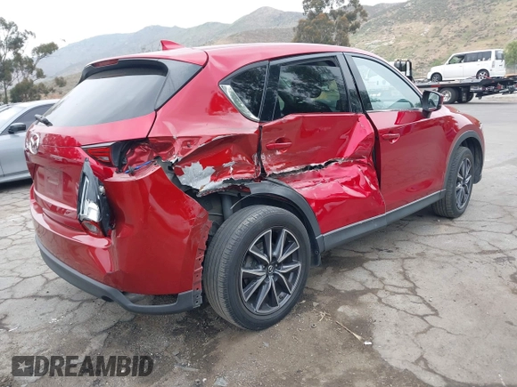 2018 Mazda CX-5 Grand Touring with VIN JM3KFADMXJ0302656, listed as a IAAI auction lot 42099173 with 125,378 mi miles and . Bid and sale history available at DreamBid. Image 4.