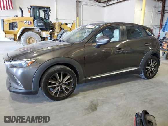 2017 Mazda CX-3 Grand Touring z VIN JM1DKFD74H0163736, wystawiony jako Copart lot #57871265 z przebiegiem 212 515 mil mil oraz Szkody całkowita. Historia ofert i sprzedaży dostępna na DreamBid. Obrazek 1.