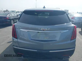 2023 Cadillac XT5 FWD Luxury z VIN 1GYKNAR49PZ137556, wystawiony jako IAAI lot #41934199 z przebiegiem 13 298 mil mil oraz . Historia ofert i sprzedaży dostępna na DreamBid. Obrazek 16.