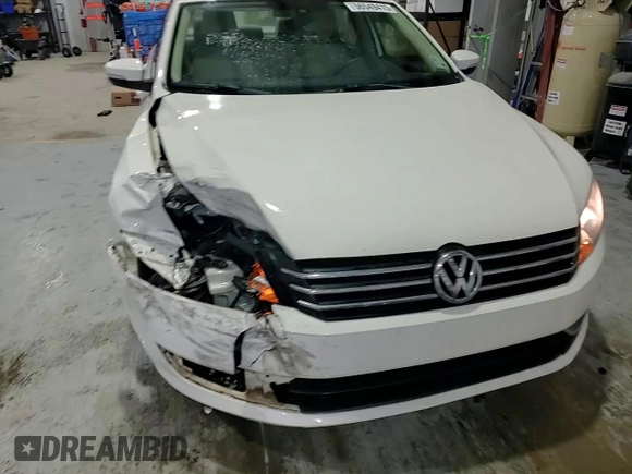 2013 Volkswagen Passat Wolfsburg Edition z VIN 1VWAH7A3XDC147667, wystawiony jako Copart lot #56549415 z przebiegiem 76 644 mil mil oraz Szkoda całkowita • Salvage title. Historia ofert i sprzedaży dostępna na DreamBid. Obrazek 13.