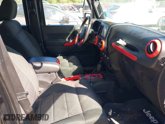 2012 Jeep Wrangler Unlimited Sport z VIN 1C4BJWDG1CL220511, wystawiony jako IAAI lot #42227037 z przebiegiem 157 914 mil mil oraz . Historia ofert i sprzedaży dostępna na DreamBid. Obrazek 5.