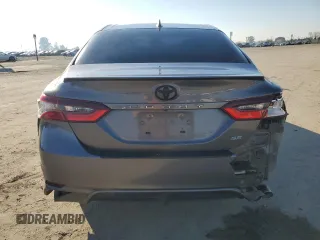 2023 Toyota Camry SE with VIN 4T1G11AK8PU732604, listed as a Copart auction lot 50635685 with 57,364 mi miles and Salvage Title. Bid and sale history available at DreamBid. Image 6.