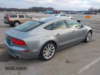 2014 Audi A7 Premium Plus z VIN WAUWGAFC9EN096702, wystawiony jako IAAI lot #41202201 z przebiegiem 103 893 mil mil oraz . Historia ofert i sprzedaży dostępna na DreamBid. Obrazek 4.