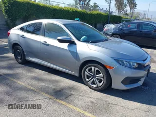 2017 Honda Civic LX z VIN 2HGFC2F57HH545976, wystawiony jako IAAI lot #42077362 z przebiegiem 128 737 mil mil oraz . Historia ofert i sprzedaży dostępna na DreamBid. Obrazek 1.