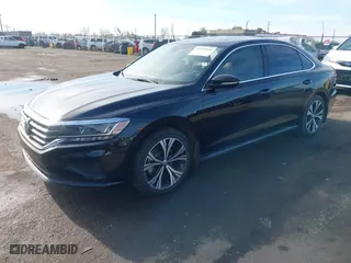 2021 Volkswagen Passat 2.0T SE with VIN 1VWSA7A39MC015718, listed as a IAAI auction lot 41233666 with 28,142 mi miles. Bid and sale history available at carsss.com. Image 2.