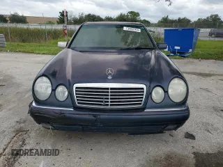 1997 Mercedes-Benz E-Class with VIN WDBJF55F4VJ025769, listed as a Copart auction lot 73460164 with 0 mi miles and Salvage Title. Bid and sale history available at carsss.com. Image 5.