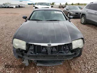 2004 Chrysler Crossfire z VIN 1C3AN69LX4X023972, wystawiony jako Copart lot #49111475 z przebiegiem 208 710 mil mil oraz Szkoda całkowita • Salvage title. Historia ofert i sprzedaży dostępna na DreamBid. Obrazek 5.