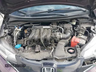 2015 Honda Fit EX-L with VIN 3HGGK5H89FM758572, listed as a IAAI auction lot 41784414 with 97,707 mi miles. Bid and sale history available at carsss.com. Image 10.