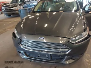 2016 Ford Fusion SE Hybrid with VIN 3FA6P0LU9GR235291, listed as a IAAI auction lot 41560312 with 112,777 mi miles. Bid and sale history available at carsss.com. Image 6.