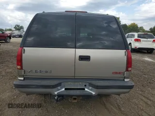 1999 GMC Yukon with VIN 1GKEK13R9XJ787877, listed as a Copart auction lot 72185044 with 191,710 mi miles and Salvage Title. Bid and sale history available at carsss.com. Image 6.