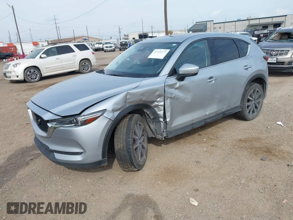 2017 Mazda CX-5 Grand Touring with VIN JM3KFBDL8H0227348, listed as a IAAI auction lot 41572377 with 124,908 mi miles. Bid and sale history available at carsss.com. Image 2.