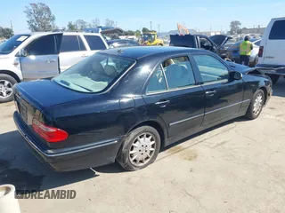 2001 Mercedes-Benz E-Class with VIN WDBJF65J11B368277, listed as a IAAI auction lot 41855716 with 207,864 mi miles. Bid and sale history available at carsss.com. Image 4.