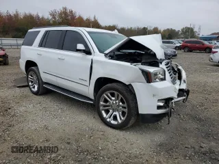 2019 GMC Yukon SLT with VIN 1GKS2BKC2KR338007, listed as a Copart auction lot 82336394 with 105,087 mi miles and Salvage Title. Bid and sale history available at carsss.com. Image 4.