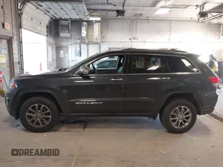 2015 Jeep Grand Cherokee Limited with VIN 1C4RJFBG5FC941811, listed as a IAAI auction lot 41003336 with 137,867 mi miles. Bid and sale history available at carsss.com. Image 14.