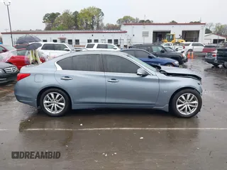 2015 Infiniti Q50 Premium with VIN JN1BV7AR4FM393974, listed as a IAAI auction lot 41874345 with 148,228 mi miles. Bid and sale history available at carsss.com. Image 13.