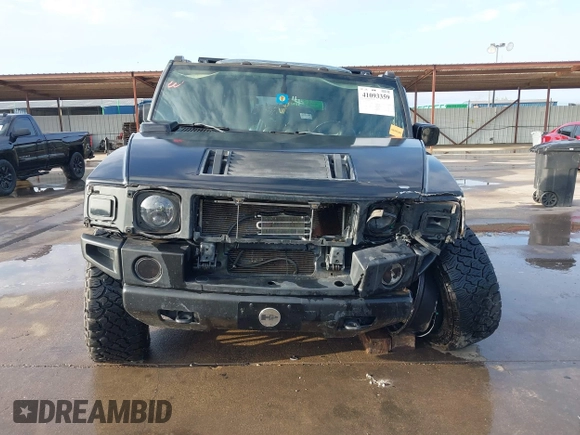 2003 Hummer H2 z VIN 5GRGN23UX3H112173, wystawiony jako IAAI lot #41093359 z przebiegiem Nie podano mil oraz . Historia ofert i sprzedaży dostępna na DreamBid. Obrazek 13.