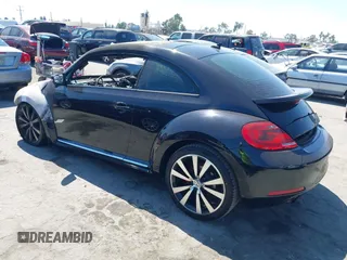 2012 Volkswagen Beetle 2.0T Black Turbo Launch Edition PZEV with VIN 3VWVA7AT1CM660177, listed as a IAAI auction lot 40282938 with 1 mi miles. Bid and sale history available at carsss.com. Image 3.
