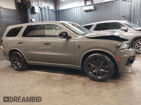 2023 Dodge Durango SRT Hellcat Premium with VIN 1C4SDJH9XPC655507, listed as a IAAI auction lot 42172418 with 1,490 mi miles and . Bid and sale history available at DreamBid. Image 14.