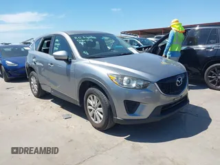 2014 Mazda CX-5 Sport with VIN JM3KE2BE7E0371203, listed as a IAAI auction lot 42243756 with 121,534 mi miles and . Bid and sale history available at DreamBid. Image 1.