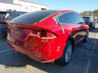 2020 Tesla Model X Long Range with VIN 5YJXCDE22LF217014, listed as a IAAI auction lot 41845824 with 149,375 mi miles and . Bid and sale history available at DreamBid. Image 4.