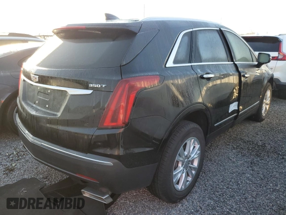 2022 Cadillac XT5 FWD Luxury z VIN 1GYKNAR47NZ100986, wystawiony jako Copart lot #83144574 z przebiegiem Nie podano mil oraz Nie do naprawy • Non repairable. Historia ofert i sprzedaży dostępna na DreamBid. Obrazek 3.