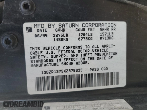 1999 Saturn SC z VIN 1G8ZR1275XZ375833, wystawiony jako Copart lot #87960885 z przebiegiem 97 697 mil mil oraz Szkody całkowita. Historia ofert i sprzedaży dostępna na DreamBid. Obrazek 12.