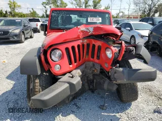 2015 Jeep Wrangler Unlimited Willys Wheeler with VIN 1C4BJWDG3FL726460, listed as a Copart auction lot 55827355 with 96,482 mi miles and Salvage Title. Bid and sale history available at DreamBid. Image 5.