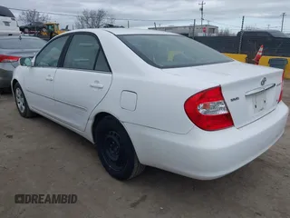 2004 Toyota Camry LE with VIN 4T1BF30K74U073676, listed as a IAAI auction lot 41668460 with 249,847 mi miles. Bid and sale history available at carsss.com. Image 3.