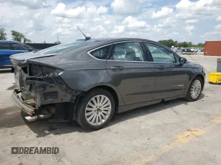 2015 Ford Fusion SE Hybrid with VIN 3FA6P0LUXFR220930, listed as a Copart auction lot 58407235 with 179,682 mi miles and Salvage title. Bid and sale history available at DreamBid. Image 3.