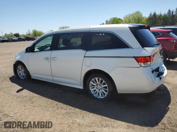 2015 Honda Odyssey Touring Elite with VIN 5FNRL5H92FB504977, listed as a Copart auction lot 56657195 with 189,438 mi miles and Salvage title. Bid and sale history available at DreamBid. Image 2.