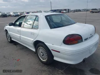 1997 Pontiac Grand Am SE with VIN 1G2NE52T3VC809661, listed as a IAAI auction lot 41100711 with 168,686 mi miles. Bid and sale history available at carsss.com. Image 3.