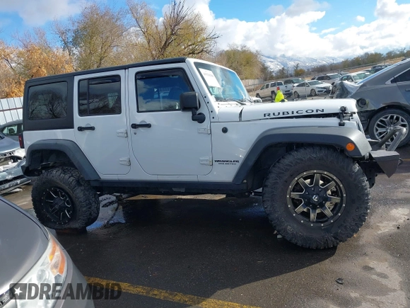 2014 Jeep Wrangler Unlimited Rubicon with VIN 1C4BJWFG2EL264792, listed as a IAAI auction lot 40938380 with 145,886 mi miles. Bid and sale history available at carsss.com. Image 14.