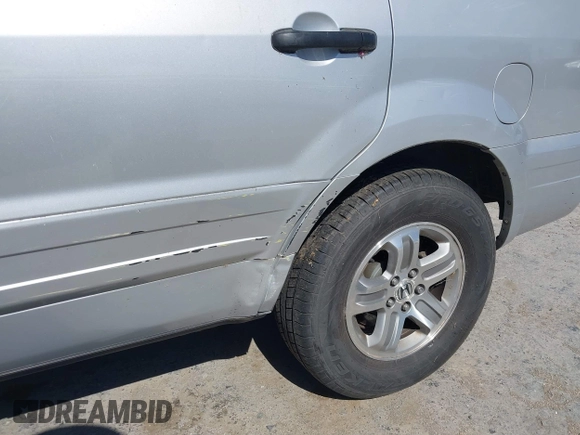 2005 Honda Pilot EX-L z VIN 2HKYF18695H545804, wystawiony jako IAAI lot #42354721 z przebiegiem 228 914 mil mil oraz . Historia ofert i sprzedaży dostępna na DreamBid. Obrazek 6.
